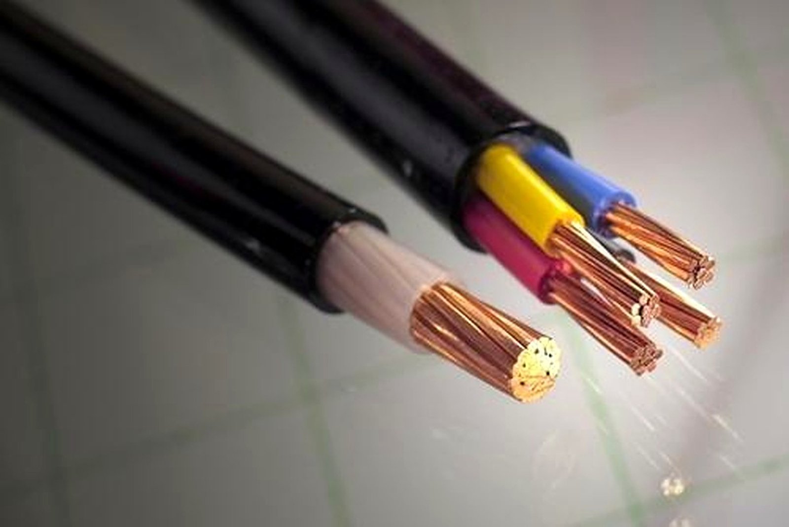 Cut power cable ends showing copper conductors and coloured cores