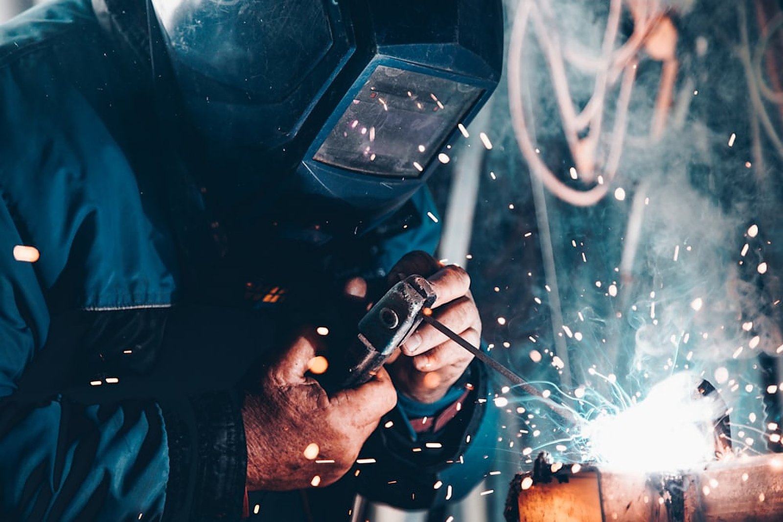 Welder at work during cable and metal fabrication